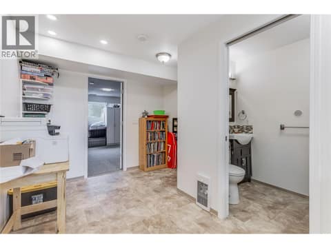 Mudroom/den showing the laundry/powder room. at 3341 Webber Road, Glenrosa, West Kelowna