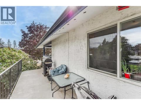 Plenty of room on the deck for a BBQ and patio furniture. at 3341 Webber Road, Glenrosa, West Kelowna