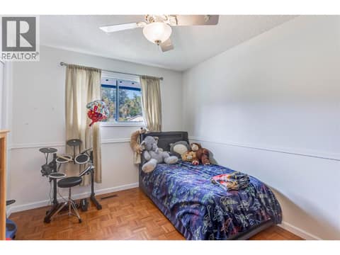 Second bedroom upstairs across from the primary. at 3341 Webber Road, Glenrosa, West Kelowna