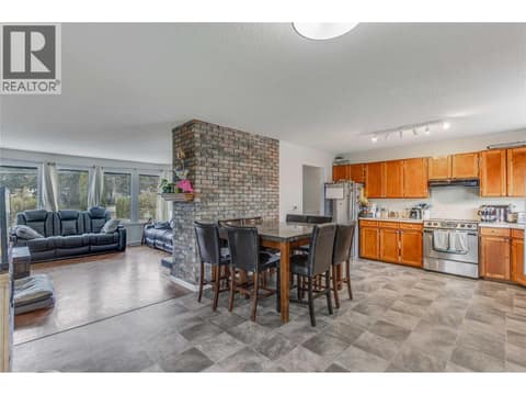 Stainless appliances and the kitchen opens nicely to the living room creating an open feel. at 3341 Webber Road, Glenrosa, West Kelowna