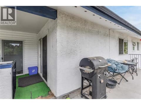 Upper-level deck. The sliding door to the left leads to the bonus room above the garage. at 3341 Webber Road, Glenrosa, West Kelowna
