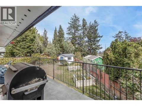 View of the backyard with a storage shed. at 3341 Webber Road, Glenrosa, West Kelowna