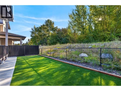 Fenced yard - with no neighbors behind at 996 Bull Crescent, Lower Mission, Kelowna
