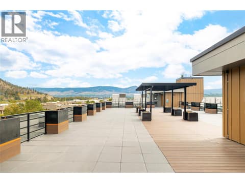 Amenities include a rooftop terrace. at 1925 Enterprise Way Unit# 406, Dilworth Mountain, Kelowna