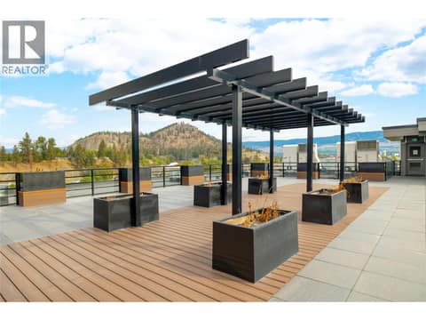 Amenities include a rooftop terrace. at 1925 Enterprise Way Unit# 406, Dilworth Mountain, Kelowna