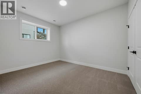 Entry Level Bedroom at 2083 Cortina Drive, Black Mountain, Kelowna