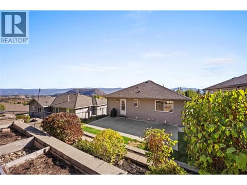 Backyard fully landscaped and private. Backs onto the forest with beautiful views of the surrounding mountains and Okanagan Lake. at 2322 Shannon Heights Place, Shannon Lake, West Kelowna