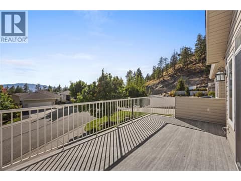 Enjoy views of Okanagan Lake and surrounding mountains from your deck and living room. at 2322 Shannon Heights Place, Shannon Lake, West Kelowna
