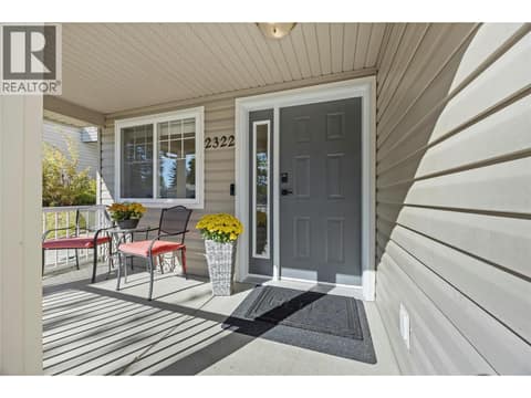 Front entrance with a welcoming porch. at 2322 Shannon Heights Place, Shannon Lake, West Kelowna