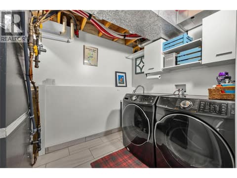 Main floor laundry at 2322 Shannon Heights Place, Shannon Lake, West Kelowna
