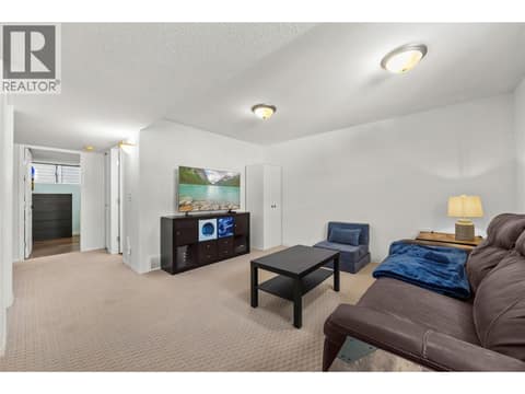 Main floor rec room attached to the 4th bedroom and full ensuite. at 2322 Shannon Heights Place, Shannon Lake, West Kelowna
