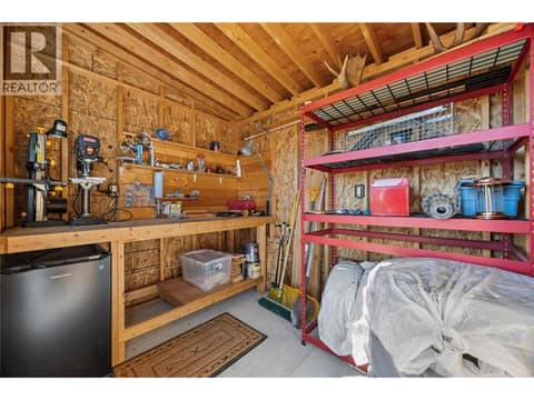 Powered shed in backyard with outdoor lounge area. at 2322 Shannon Heights Place, Shannon Lake, West Kelowna
