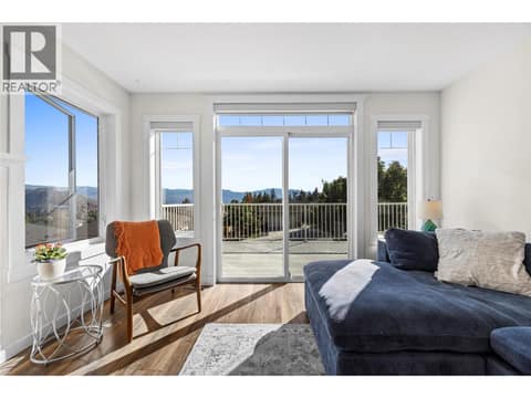 Upstairs living area access to front deck with lake views at 2322 Shannon Heights Place, Shannon Lake, West Kelowna