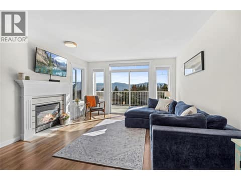 Upstairs main living area opens to front deck with incredible lake and mountain views. at 2322 Shannon Heights Place, Shannon Lake, West Kelowna