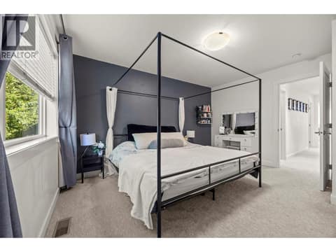 Primary king-ensuite with great views. Private and quiet. On a split plan from the other 2 bedrooms. at 10724 Bottom Wood Lake Road Unit# 4, Lake Country South West