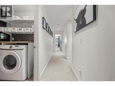 Upstairs laundry room with ample storage at 10724 Bottom Wood Lake Road Unit# 4, Lake Country South West