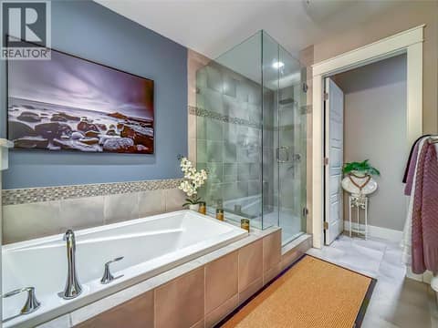 5 piece ensuite oasis with separate toilet room, a large custom tile shower and soaker tub. at 3359 Cougar Road Unit# 60, Westbank Centre, West Kelowna
