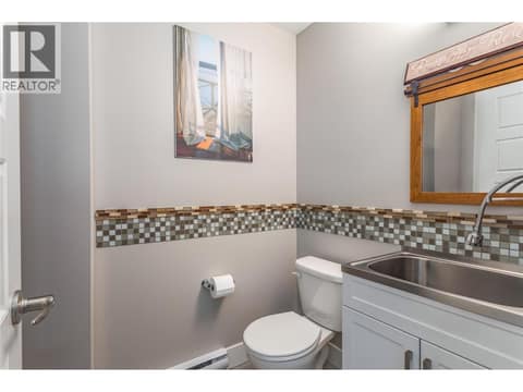 Garage bathroom and storage. at 3359 Cougar Road Unit# 60, Westbank Centre, West Kelowna