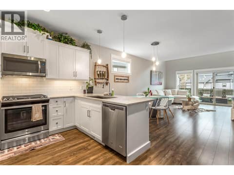 Gas range and stainless steel appliances. at 3359 Cougar Road Unit# 60, Westbank Centre, West Kelowna