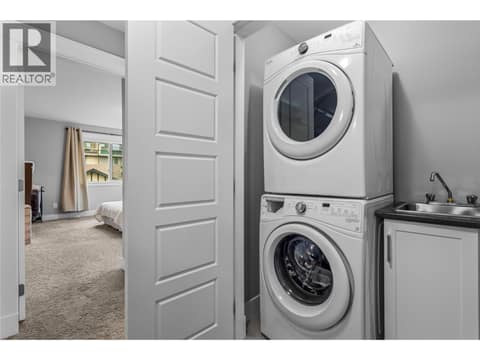 In unit laundry with sink. at 3359 Cougar Road Unit# 60, Westbank Centre, West Kelowna
