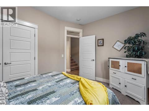 Large guest bedroom on main floor. at 3359 Cougar Road Unit# 60, Westbank Centre, West Kelowna