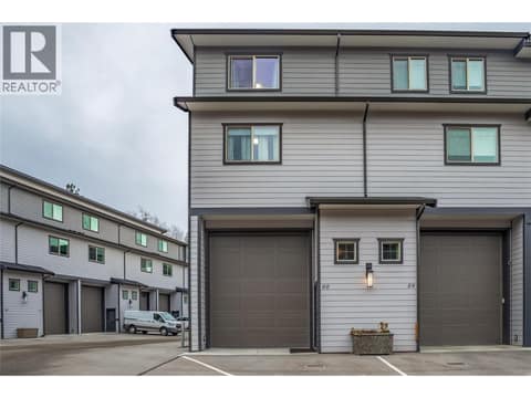 Massive 14 foot high 12 foot wide garage door. Your lifted truck will fit. at 3359 Cougar Road Unit# 60, Westbank Centre, West Kelowna