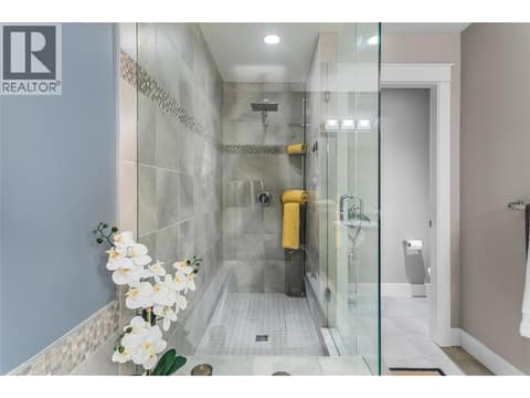Oversized custom tile shower with 10M tempered glass in ensuite. at 3359 Cougar Road Unit# 60, Westbank Centre, West Kelowna
