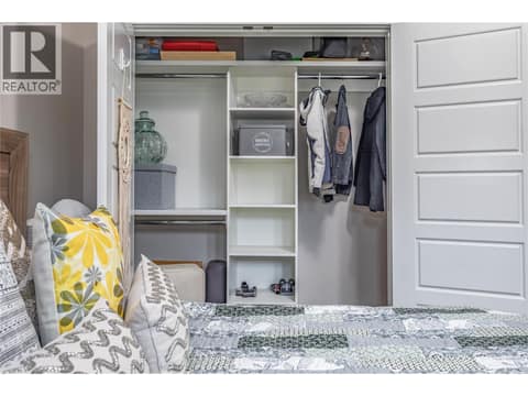 Well designed custom millwork in closets to keep you organized maximizing storage space. at 3359 Cougar Road Unit# 60, Westbank Centre, West Kelowna