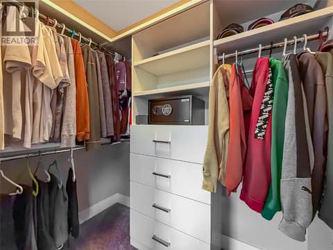 Well designed custom millwork in walk in closets to keep you organized maximizing storage space. Master bedroom. at 3359 Cougar Road Unit# 60, Westbank Centre, West Kelowna