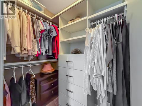 Well designed custom millwork in walk in closets to keep you organized maximizing storage space. Master bedroom. at 3359 Cougar Road Unit# 60, Westbank Centre, West Kelowna