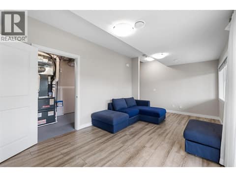 Basement rec room for the main home connect to the utility room at 695 Concordia Street, University District, Kelowna