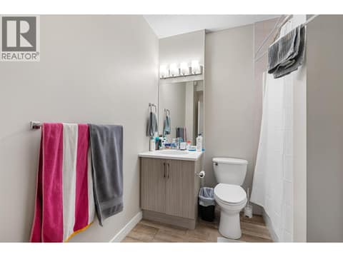 Full bathroom in the legal suite at 695 Concordia Street, University District, Kelowna
