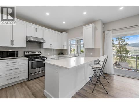 Large island with open kitchen at 695 Concordia Street, University District, Kelowna