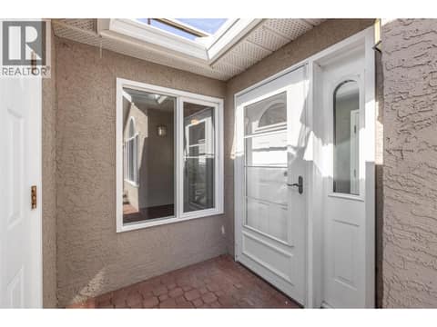 Covered porch to garage entry at 1020 Lanfranco Road Unit# 28, Lower Mission, Kelowna