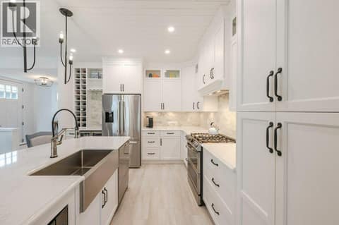 Farmhouse sink, pantry with pull-out drawers at 2450 Radio Tower Road Unit# 58, Oliver Rural