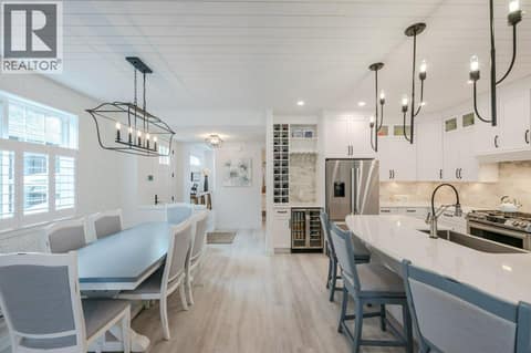 Front entry, dining & kitchen at 2450 Radio Tower Road Unit# 58, Oliver Rural