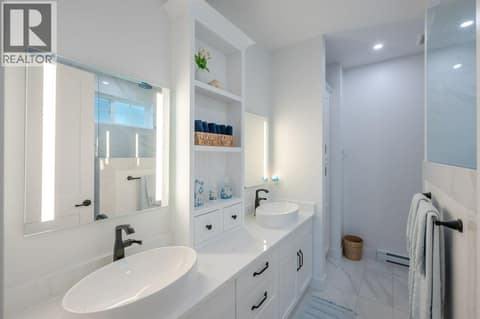 Primary bedroom ensuite with dual vanities at 2450 Radio Tower Road Unit# 58, Oliver Rural