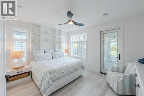 Primary bedroom with sunroom access at 2450 Radio Tower Road Unit# 58, Oliver Rural