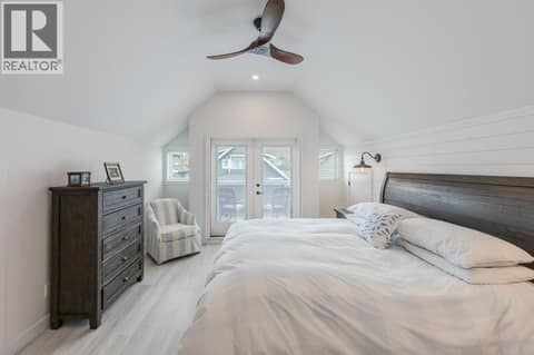 Upper level bedroom with vaulted ceiling, balcony & 3-piece ensuite at 2450 Radio Tower Road Unit# 58, Oliver Rural