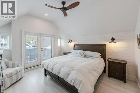 Upper level bedroom with vaulted ceiling, balcony & 3-piece ensuite at 2450 Radio Tower Road Unit# 58, Oliver Rural