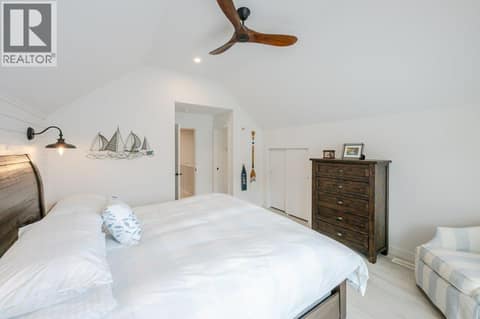Upper level bedroom with vaulted ceiling, balcony & 3-piece ensuite at 2450 Radio Tower Road Unit# 58, Oliver Rural