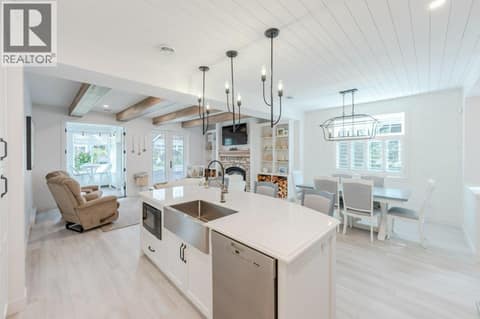 View from kitchen to living room & dining room at 2450 Radio Tower Road Unit# 58, Oliver Rural