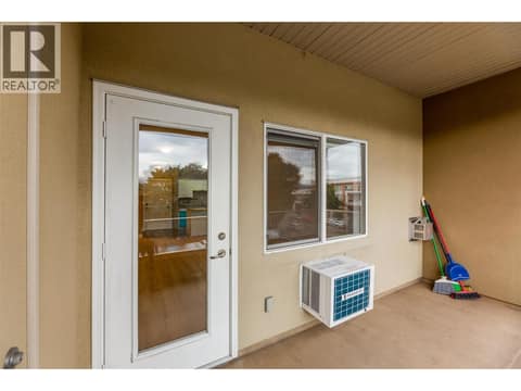 Covered balcony with a Phantom screen for comfortable outdoor living - BBQs Allowed! at 1125 Bernard Avenue Unit# 302, Kelowna North