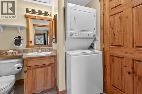 4 piece bathroom accessible from 2nd bedroom and living room, contains laundry as well at 701 14A Crescent Unit# 214, Invermere