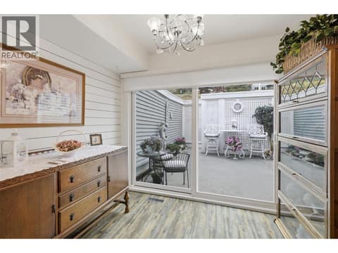 Breakfast nook or sitting room leading to courtyard with sliding patio doors at 1795 Summit Drive Unit# 11, Sahali, Kamloops