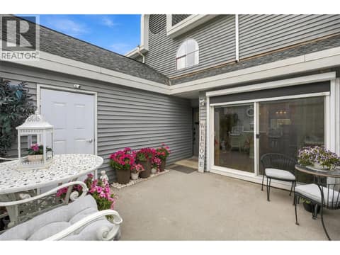 Courtyard with sliding patio doors and remote blinds at 1795 Summit Drive Unit# 11, Sahali, Kamloops