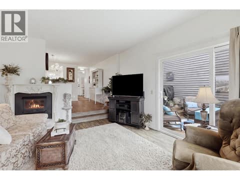 Sunken living room with sliding patio doors to deck at 1795 Summit Drive Unit# 11, Sahali, Kamloops