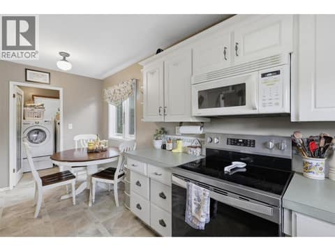 Kitchen with break fast nook at 723 Moody Place, Brocklehurst, Kamloops