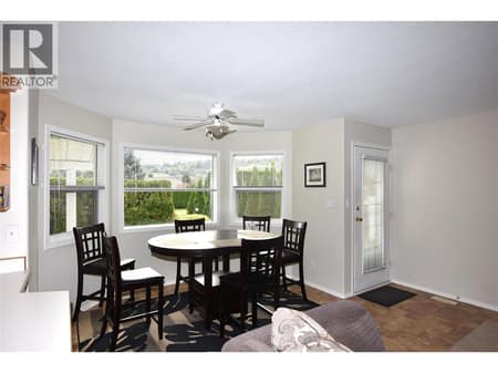 Dining space beside the kitchen at 415 4 Street, Swan Lake West, Vernon