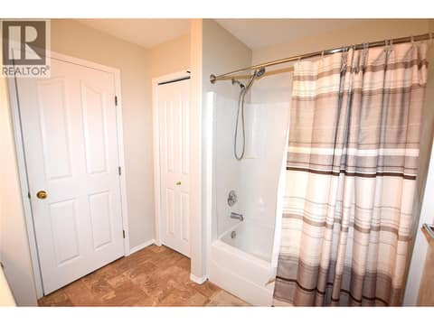 Linen closet in the main bath at 415 4 Street, Swan Lake West, Vernon
